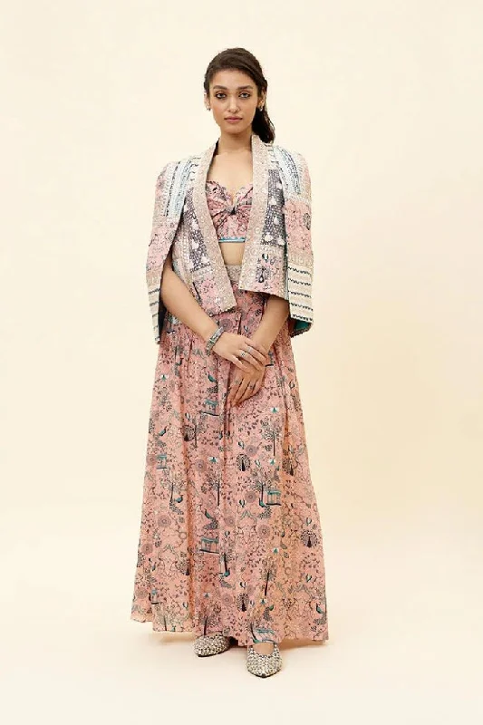 PINK MOR JAAL PRINT BIKINI BUSTIER TEAMED WITH BOX PLEATED PANTS AND A PATCHWORK NOOR CAPE JACKET Wool Jacket Cashmere Jacket Tweed Jacket